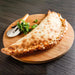 Rustic Calzone Chorizo, Fried Onion, Tomato Mozzarella - 250 grams each Don Arancini